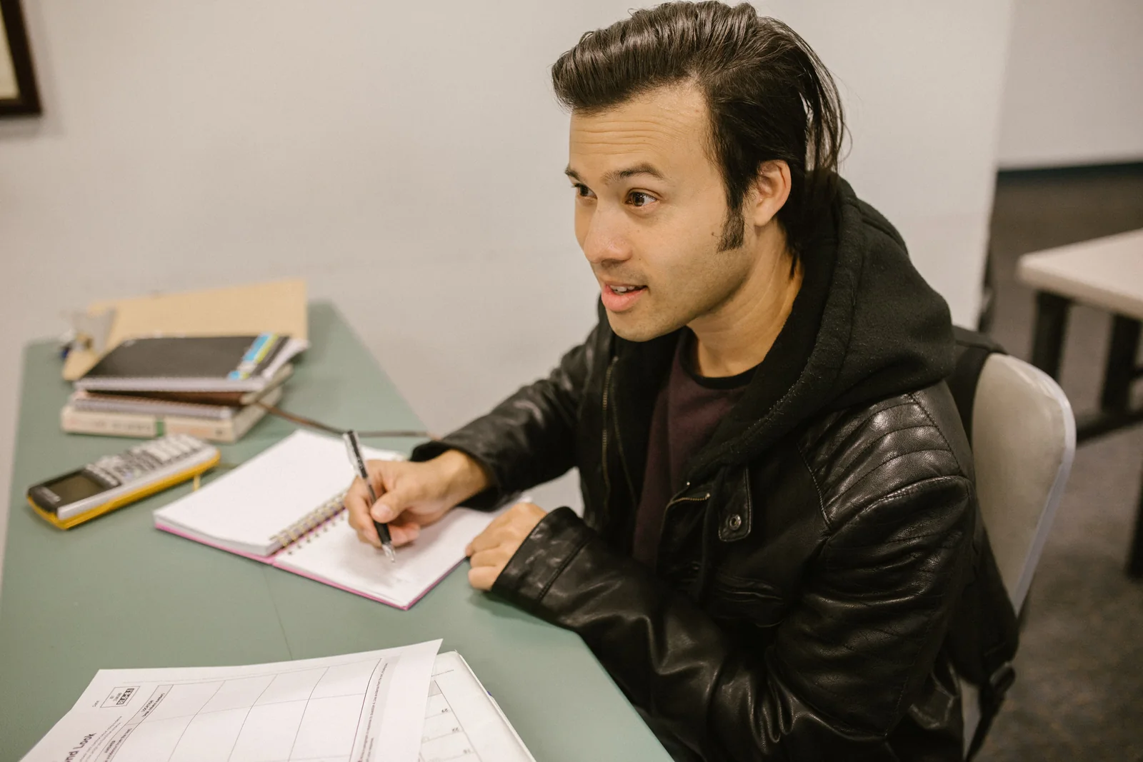 Student studying with notes